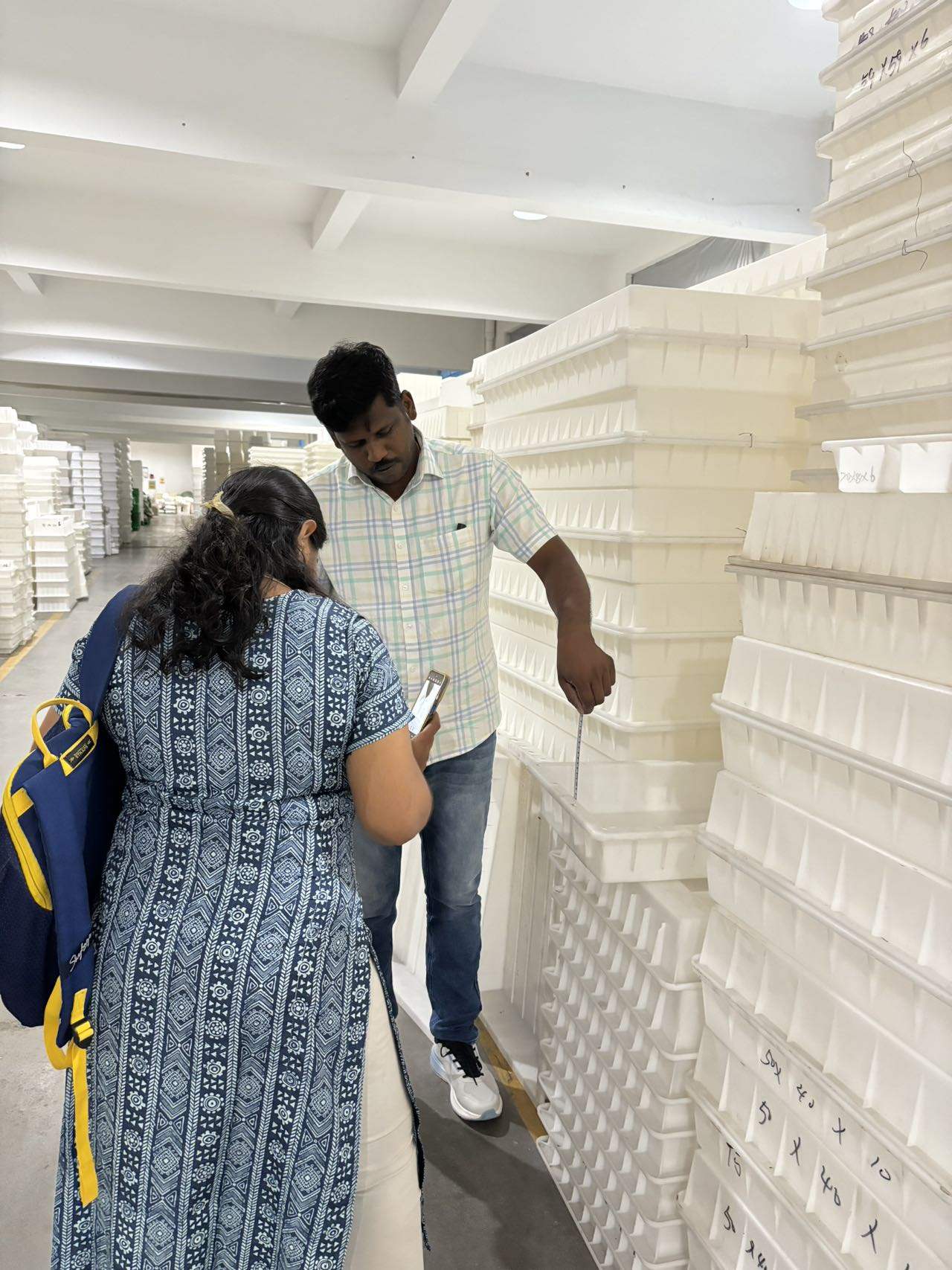 Client inspecting mould samples at Zhihua Moulds